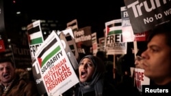 Protesters demonstrate outside the U.S. embassy against President Donald Trump's decision to recognize Jerusalem as Israel's capital, in London, Dec. 8, 2017.