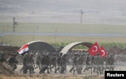Turkish and Iraqi troops participate in a joint military exercise near the Turkish-Iraqi border in Silopi, Turkey, Sept. 26, 2017.