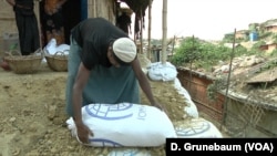 Refugees are using sandbags to shore up the hills in the refugees camps.