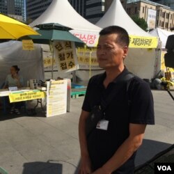 Lee Jeong-chul lost his teenage son when the South Korean ferry the Sewol sank in April. (Photo: Jason Strother for VOA)