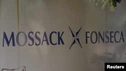 FILE - The Mossack Fonseca law firm logo is seen on a wall in Panama City, April 3, 2016. The allegations against Messi surfaced as part of a massive data leak of more than 11.5 million documents from the Panama-based law firm.