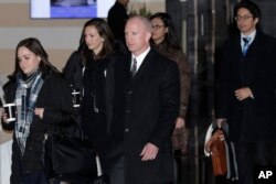 Deputy U.S. Trade Representative Jeffrey D. Gerrish, center, and members of his delegation leave the Westin hotel in Beijing, China, Jan. 7, 2019, for talks with their Chinese counterparts.