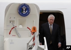 U.S. Secretary of State Rex Tillerson exits his plane as he arrives in Mexico for a two-day visit, at Benito Juarez airport in Mexico City, Feb. 1, 2018.