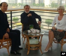 John and Doris Naisbitt with Chinese official Wang Jianzhong.