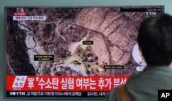 FILE - A man watches a TV news program reporting North Korea's nuclear test at Seoul Railway Station in Seoul, South Korea, Sept. 9, 2016.