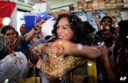 Supporters and members of the LGBT community celebrate after the country's top court struck down a colonial-era law that makes homosexual acts punishable by up to 10 years in prison, in Mumbai, India, Sept. 6, 2018.