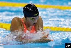 Russia's Yulia Efimova competes in a women's 100-breaststroke heat during the swimming competitions at the 2016 Summer Olympics in Rio de Janeiro, Brazil, Aug. 7, 2016.