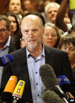 Olympic athlete Oscar Pistorius' uncle, Arnold Pistorius, speaks to journalists at the end of the bail hearing at the magistrate court in Pretoria, South Africa, Feb. 22, 2013.