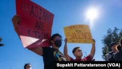 Protesters hold placards during the Asian Justice Rally. Some Asian organizations held a rally in five cities of the United States demanding justice for Asian-American crime victims. These five cities are Los Angeles, New York, San Francisco, Chicago and