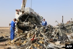 Russian emergency services personnel working at the crash site of a A321 Russian airliner in Wadi al-Zolomat, a mountainous area of Egypt's Sinai Peninsula. (Russian Emergency Ministry Handout photo)