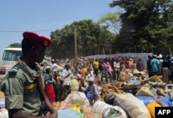 FILE - Refugees from Central Africa Republic wait for a food distribution at an UNHCR refugee camp in the eastern Cameroonian city of Garoua-Boulai, not far from the border with Central Africa Republic, March 13, 2014.