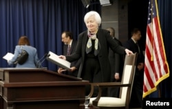 FILE - U.S. Federal Reserve Chair Janet Yellen takes her seat to conduct a press conference following the two-day Federal Open Market Committee policy meeting in Washington, March 16, 2016.