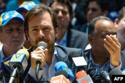 FILE - Ramon Muchacho speaks during a press conference at the Bolivar square in the Chacao neighborhood in Caracas, May 25, 2017.