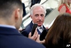 FILE - Sen. Bob Corker, R-Tenn., listens to a reporter's question on Capitol Hill, Oct. 3, 2018 in Washington.