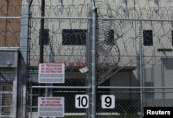 FILE - The entrance to U.S. Customs and Immigration Enforcement's Otay Mesa detention facility is shown in Otay Mesa, California, March 28, 2017.