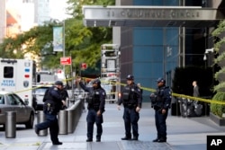 New York City Police Dept. officers arrive outside the Time Warner Center, in New York, Oct. 24, 2018.
