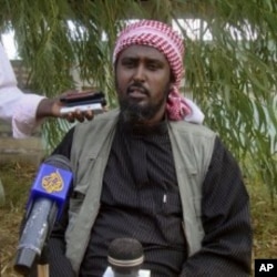Al-Shabab spokesperson Ali Mohamud Rage holds a news conference in Mogadishu, Somalia, threatening Kenya, October 17, 2011.