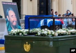 FILE - The funeral procession carrying the ashes of Fidel Castro leaves the town of Santa Clara, Cuba, Dec. 1, 2016.