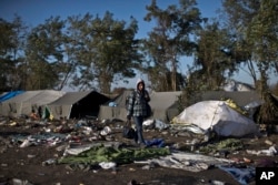 A youth walks toward Serbia's border with Croatia, in Berkasovo, Serbia, Oct. 25, 2015. Thousands of migrants and refugees are still crossing from Serbia into Croatia and continuing their journey towards Western Europe.