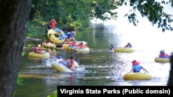 A group of friends enjoy a day of tubing at James River State Park.