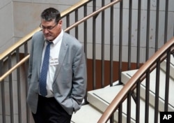 FILE - Glenn Simpson, founder of the research firm Fusion GPS, arrives for a scheduled appearance before a closed House Intelligence Committee hearing on Capitol Hill in Washington, Nov. 14, 2017.