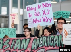 Community members protest the treatment of Dr. David Dao, who was forcibly removed from a United Airlines flight by the Chicago Aviation Police, at O'Hare International Airport in Chicago, Illinois, April 11, 2017.