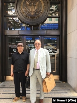 Guillermo Peralta with his pro-bono lawyer, Craig Shagin, at the entrance of the U.S. Immigration Court in Philadelphia.