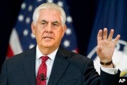 Secretary of State Rex Tillerson gestures while speaking to State Department employees at the State Department in Washington, May 3, 2017.