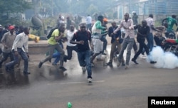 FILE - Protesters, rallying against what they see as a biased electoral commission, run away from police during clashes in Nairobi, Kenya, May 16, 2016. The country is scheduled to hold presidential and parliamentary elections in August 2017.