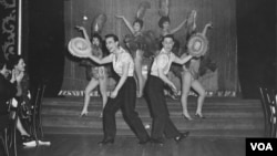 Jimmy “Jay” Borges, left, and Tony Wing in performance at Forbidden City; Wing’s sister, Arlene, is seen above his head; Sisko Borges, Jimmy Jay’s then-wife, is behind Jay, to the right, 1959 (Courtesy DeepFocus Productions, Inc.).