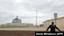 ROMANIA -- U.S. Army personnel stands at the red carpet ahead an inauguration ceremony of the U.S. anti-missile station Aegis Ashore Romania (in the background) at the military base in Deveselu, May 12, 2016