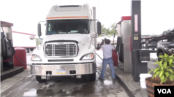 Elias Balima, an immigrant from Burkina Faso, fuels up the truck he spent years saving to buy and now rarely finds himself without work.