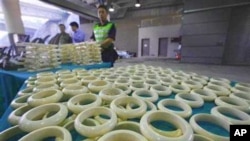 Customs officials in Hong Kong with illegal ivory products they intercepted in November last year. Some wildlife experts warn that a legal trade in ivory has previously resulted in an increase in the poaching of elephants for their tusks.