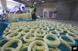 Customs officials in Hong Kong with illegal ivory products they intercepted in November last year. Some wildlife experts warn that a legal trade in ivory has previously resulted in an increase in the poaching of elephants for their tusks.