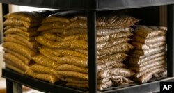 Bags of sample yellow soybeans are stored at Deerfield Farms Service on April 5, 2018, at the facility in Volant, Pa. After the Trump administration unveiled plans to impose tariffs on $50 billion in Chinese imports