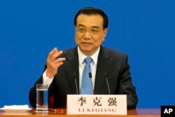Chinese Premier Li Keqiang speaks during a press conference held at the conclusion of the annual meeting of China's National People's Congress at the Great Hall of the People in Beijing, March 15, 2017.