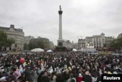 FILE - housands of Muslims gather in Trafalgar Square in London to celebrate the festival of Eid al-Fitr, Oct. 28, 2006.
