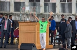 Ethiopia’s prime minister, Abiy Ahmed, waves to the crowd at a large rally in his support, in Meskel Square in the capital, Addis Ababa, Ethiopia, June 23, 2018.