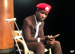 FILE - Ugandan pop star-turned-lawmaker Bobi Wine attends the National Press Club in Washington, Sept. 6, 2018.