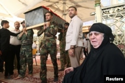 Mourners carry the coffin of their relative, who was killed in a suicide vehicle bomb in the Karrada shopping area in Baghdad, during the funeral in Najaf, south of Baghdad, Iraq, July 3, 2016.