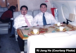 A senior North Korean defector, Ri Jong Ho, right, who oversaw North Korea’s overall production and trade while serving at the Office 39 for decades, heads to Pyongyang with Chinese investment tycoon Sam Pa, December 2006.