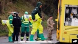 Military forces work on a van in Winterslow, England, March 12, 2018, as investigations continue into the nerve-agent poisoning of Russian ex-spy Sergei Skripal and his daughter, Yulia, in Salisbury, England, on March 4,2018.