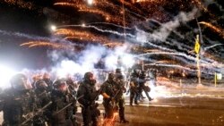 Police use chemical irritants and crowd control munitions to disperse protesters during a demonstration in Portland, Ore., Saturday, Sept. 5, 2020.