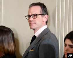 FILE - Michael Anton waits in the East Room of the White House in Washington of the start of President Donald Trump's news conference, Feb. 16, 2017.