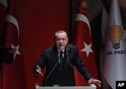FILE - Turkish President and ruling Justice and Development (AK) Party chair Recep Tayyip Erdogan speaks at a meeting of his party in Ankara, Dec. 6, 2018. “No one can lecture our country about democracy, human rights, and freedom,” Erdogan said a recent event.