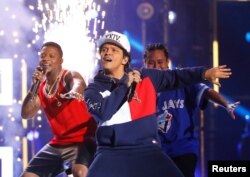 FILE - Bruno Mars performs on stage at the 2016 MTV Europe Music Awards at the Ahoy Arena in Rotterdam, Netherlands, Nov. 6, 2016.