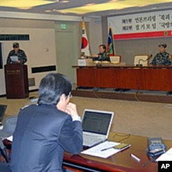 Former North Korean soldiers, who have joined a resistance group, briefing reporters