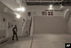 Sean Aucutt comes to the Fronton Building in downtown Boise every week to practice with the band, Amuma Says No.