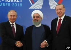 From left, Russian President Vladimir Putin, Iran's President Hassan Rouhani and Turkey's President Recep Tayyip Erdogan are pictured in Tehran, Iran, ahead of their summit to discuss Syria, Sept. 7, 2018.