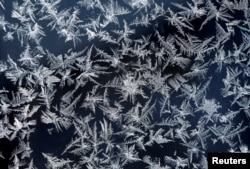 A window with frost pattern is pictured on top of the highest German mountain, the Zugspitze, in Garmisch-Partenkirchen, Germany February 28, 2018.